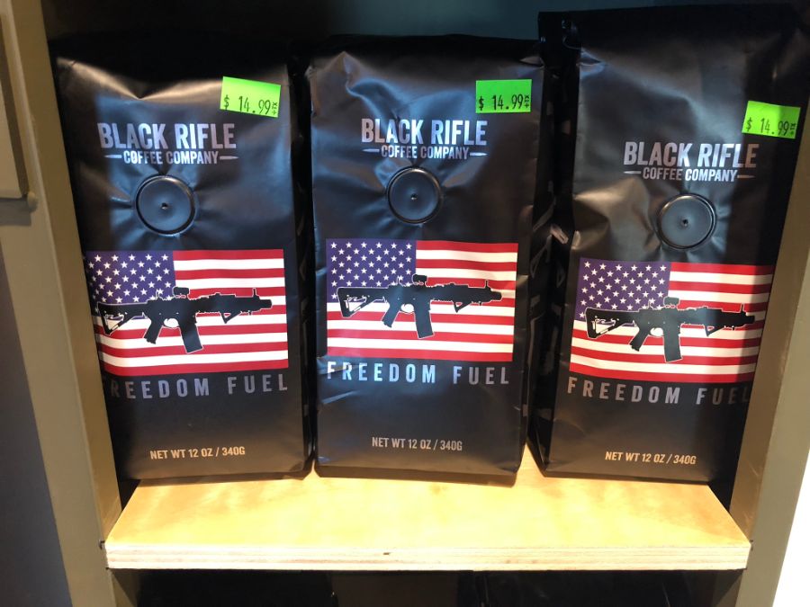 Bags of Black Rifle Coffee Company coffee on a shelf at Timberline Firearms