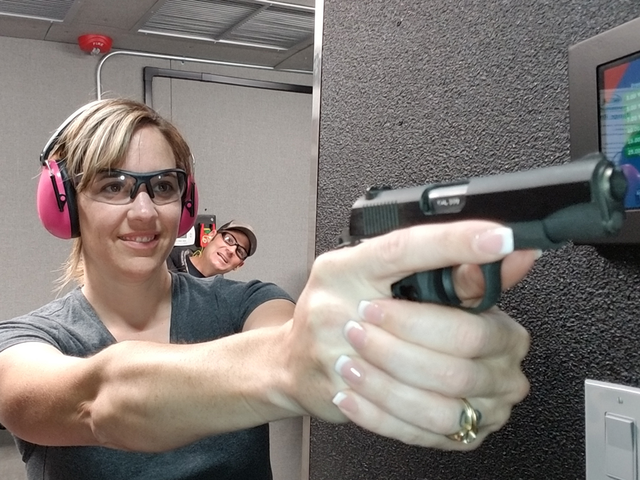Close-up of first time shooter holding a handgun at Timberline Firearms