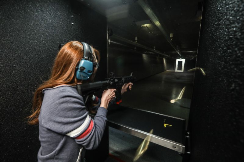 Woman shooting AR15 at Timberline Firearms.